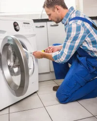 handyman-fixing-washing-machine_13339-94395